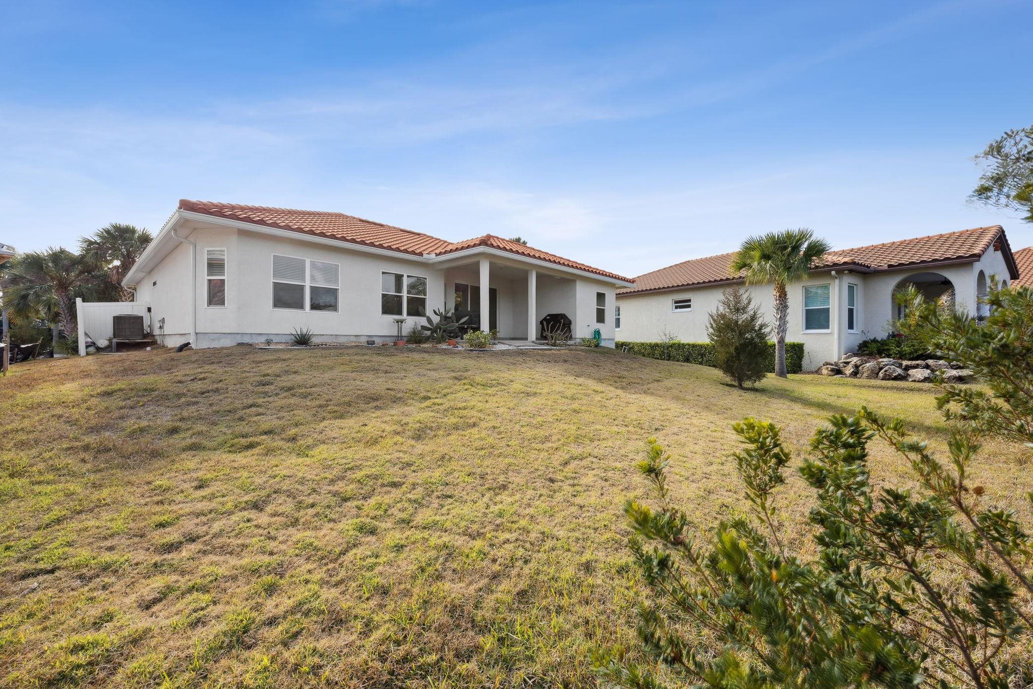 121 Spoonbill Point Court St. Augustine, FL 32080 - Photo 25 of 56 a front view of a house with a yard