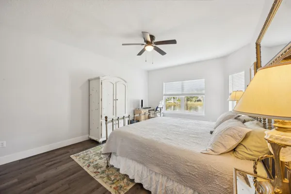 a bathroom with a granite countertop double vanity and a sink