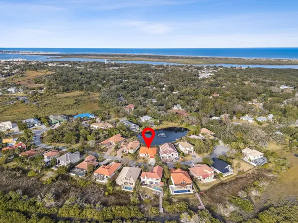 an aerial view of residential building and lake