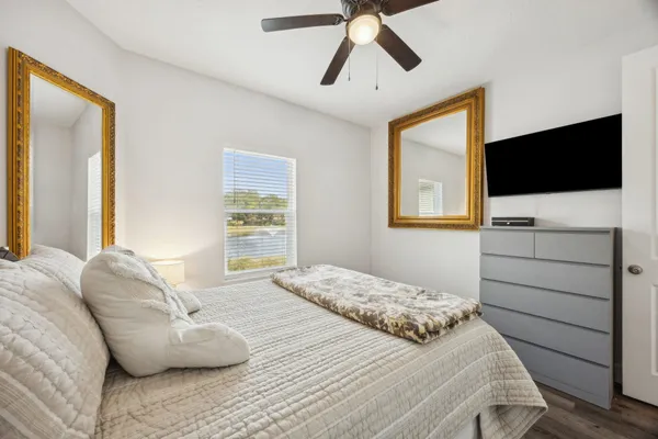 a bedroom with a bed and a window