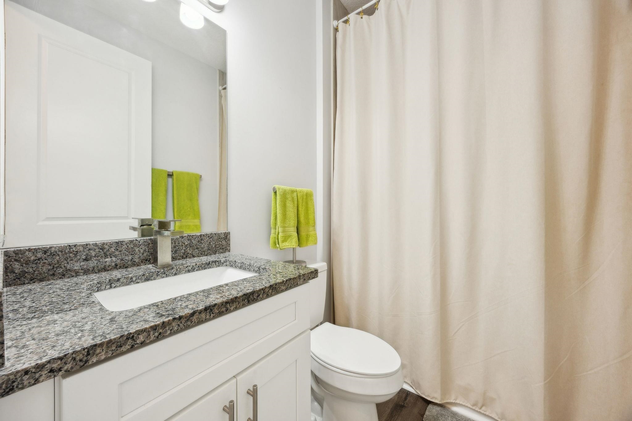 121 Spoonbill Point Court St. Augustine, FL 32080 - Photo 37 of 56 a bathroom with a granite countertop sink and a mirror