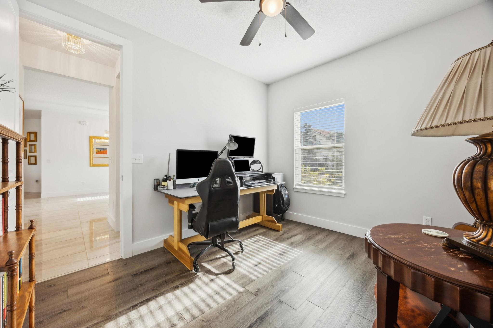 121 Spoonbill Point Court St. Augustine, FL 32080 - Photo 39 of 56 a view of a workspace with furniture and a window
