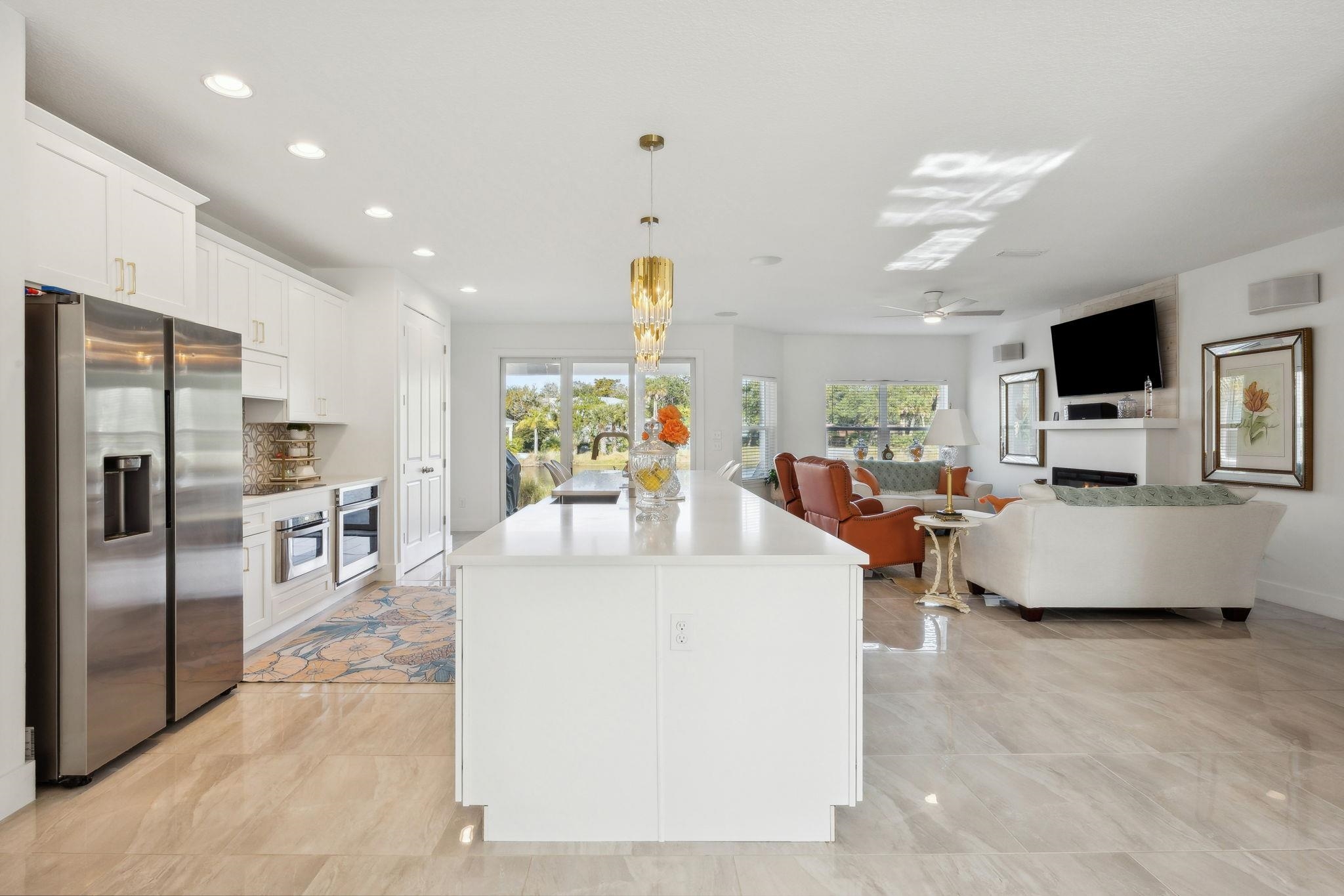121 Spoonbill Point Court St. Augustine, FL 32080 - Photo 54 of 56 a living room with fireplace furniture and a flat screen tv