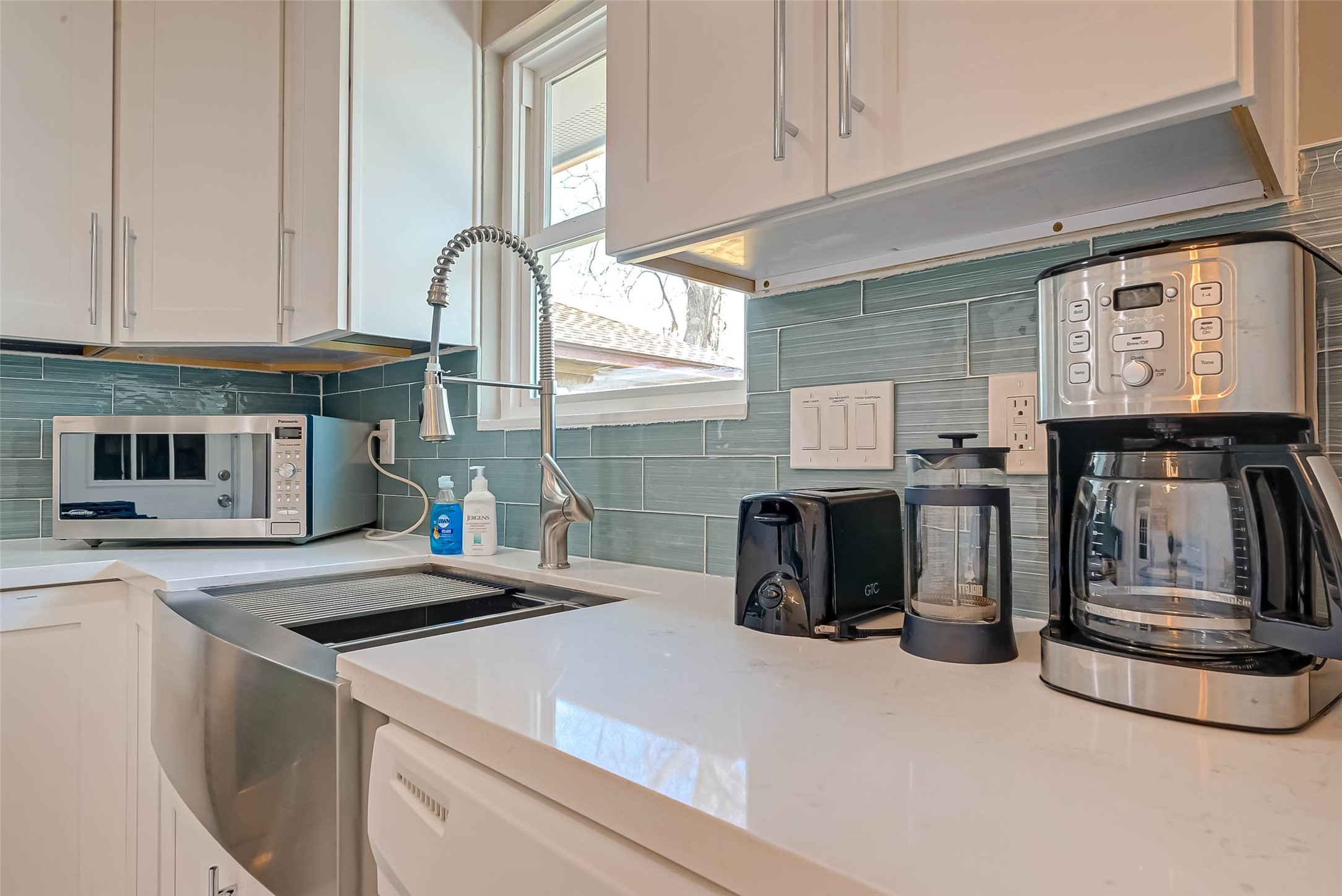 5330 Hialeah Drive Houston, TX 77092 - Photo 11 of 29 a kitchen with stainless steel appliances a stove a sink and a microwave