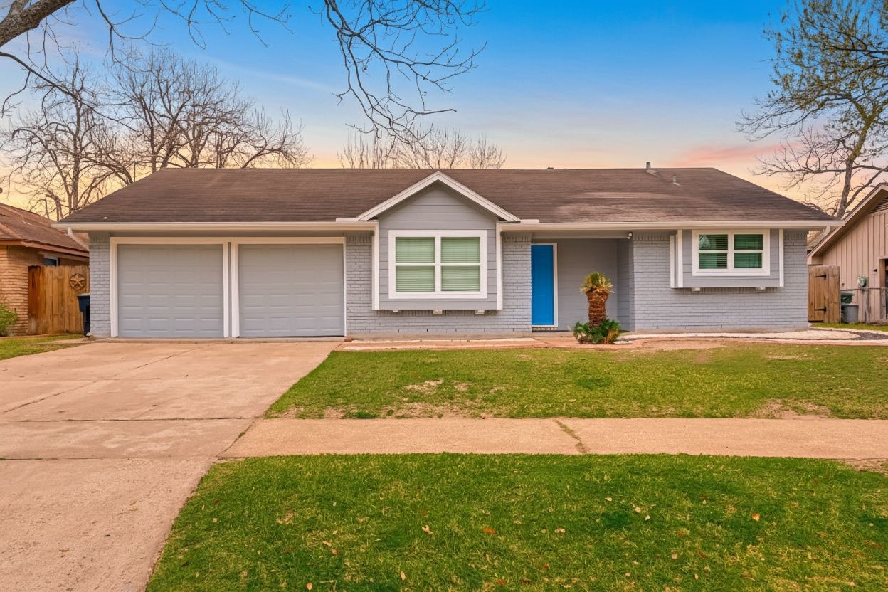 5330 Hialeah Drive Houston, TX 77092 - Photo 2 of 29 a front view of a house with a yard