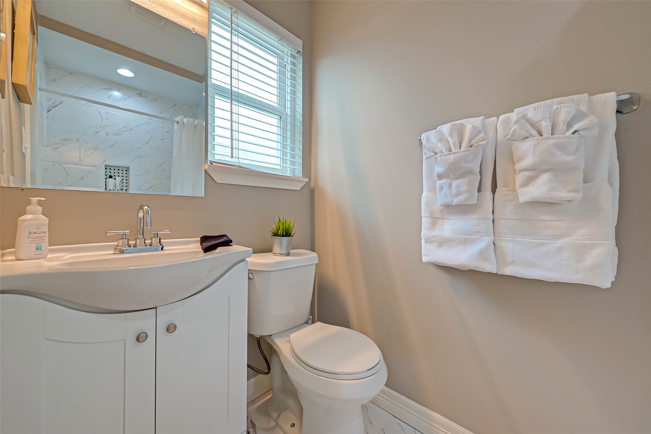 5330 Hialeah Drive Houston, TX 77092 - Photo 24 of 29 a bathroom with a sink and mirror with toilet