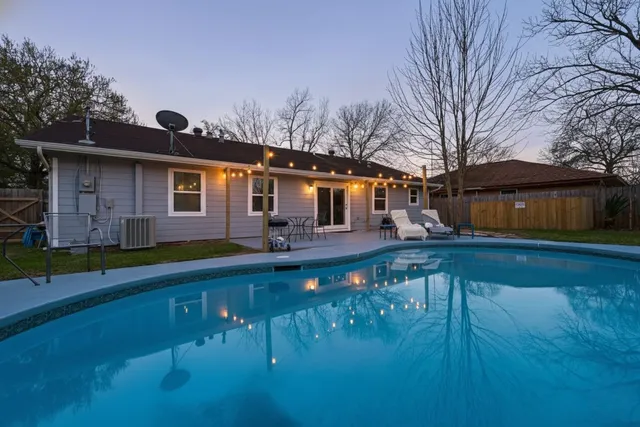 a front view of house with yard and outdoor seating