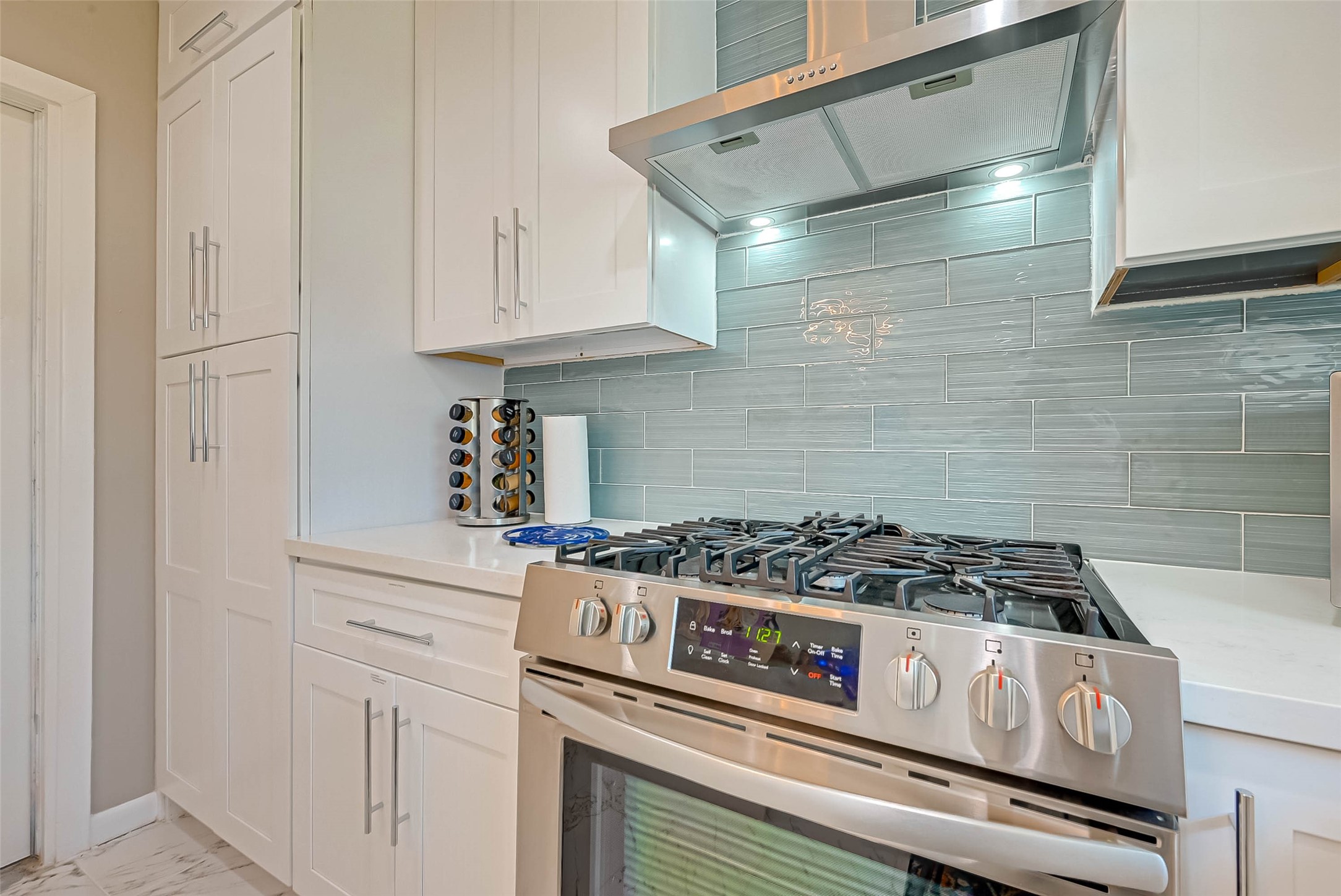 5330 Hialeah Drive Houston, TX 77092 - Photo 10 of 29 a stove top oven sitting inside of a kitchen