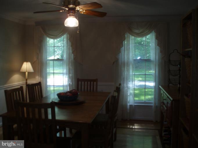 10705 Seneca Spring Way Gaithersburg, MD 20886 - Photo 14 of 28 Dining Room with Floor to Ceiling Windows
