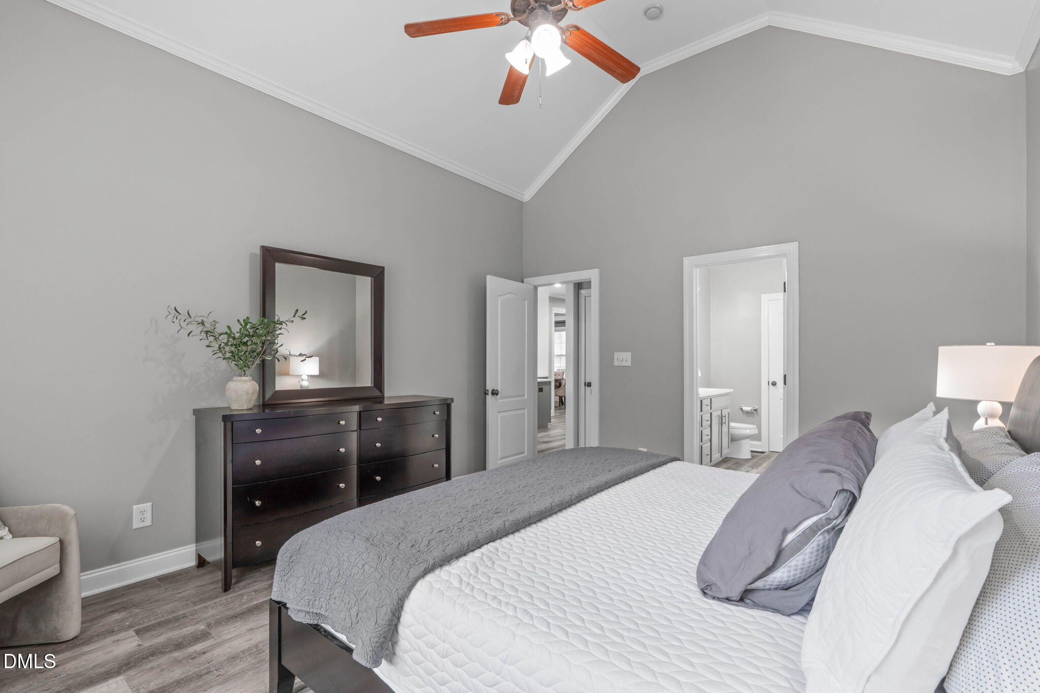 2450 Rolling Tracks Road Willow Spring, NC 27592 - Photo 29 of 64 a bedroom with a bed and wooden floor