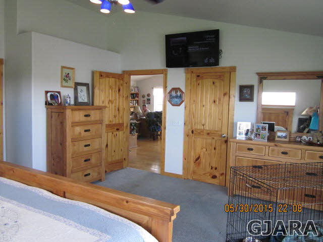 777 R Road Mack, CO 81525 - Photo 2 of 9 a spacious bedroom with a bed and a dresser