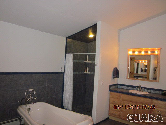 777 R Road Mack, CO 81525 - Photo 6 of 9 a bathroom with a sink a toilet and mirror