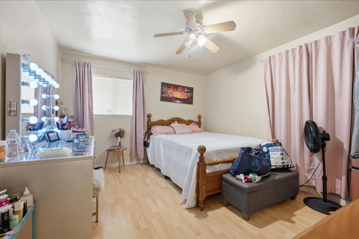 1705 Stetson Avenue Modesto, CA 95350 - Photo 13 of 32 a bedroom with a bed couches and a flat tv screen