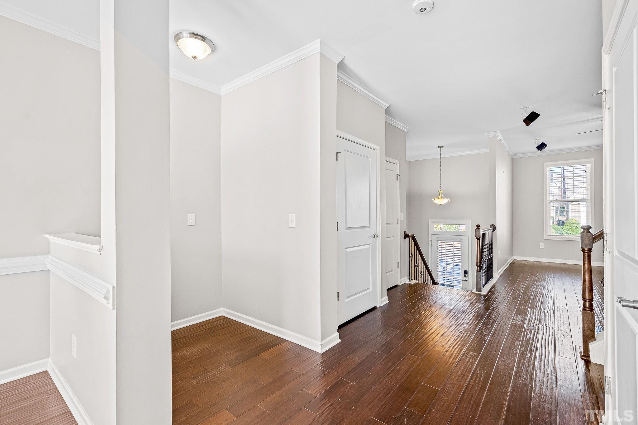 5637 Wade Park Boulevard Raleigh, NC 27607 - Photo 11 of 37 a view of a hallway with wooden floor