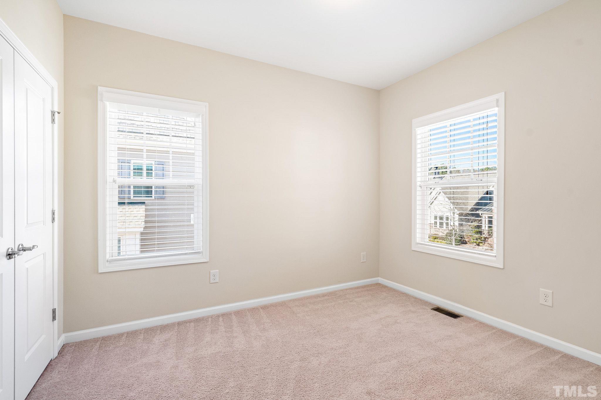 5637 Wade Park Boulevard Raleigh, NC 27607 - Photo 24 of 37 an empty room with a window