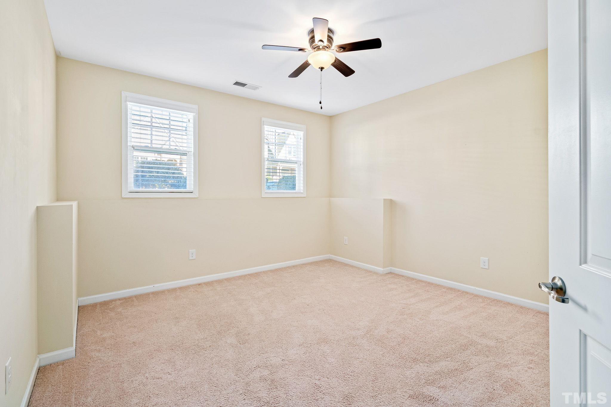 5637 Wade Park Boulevard Raleigh, NC 27607 - Photo 30 of 37 a view of an empty room with a window