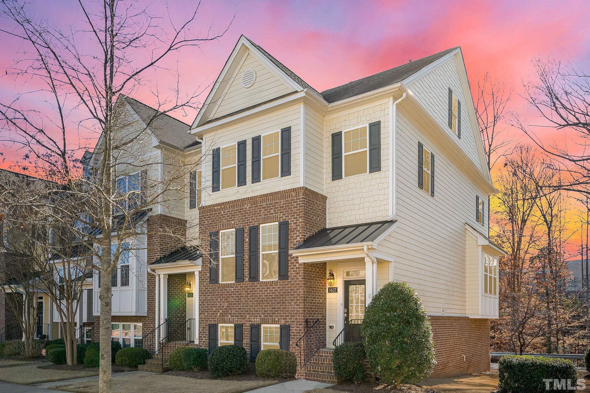 5637 Wade Park Boulevard Raleigh, NC 27607 - Photo 3 of 37 a view of a white house next to a yard