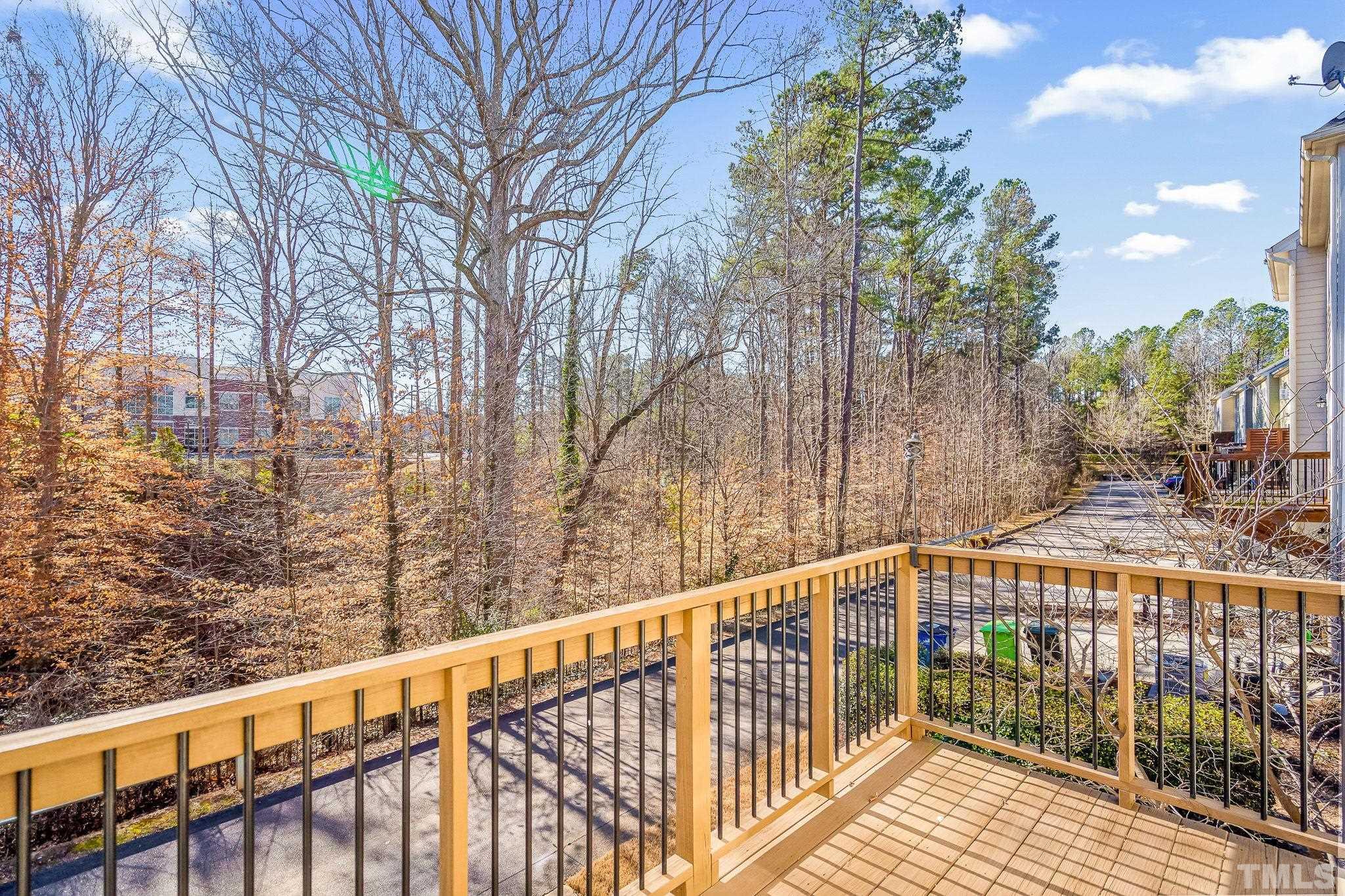 5637 Wade Park Boulevard Raleigh, NC 27607 - Photo 34 of 37 a view of a balcony with trees