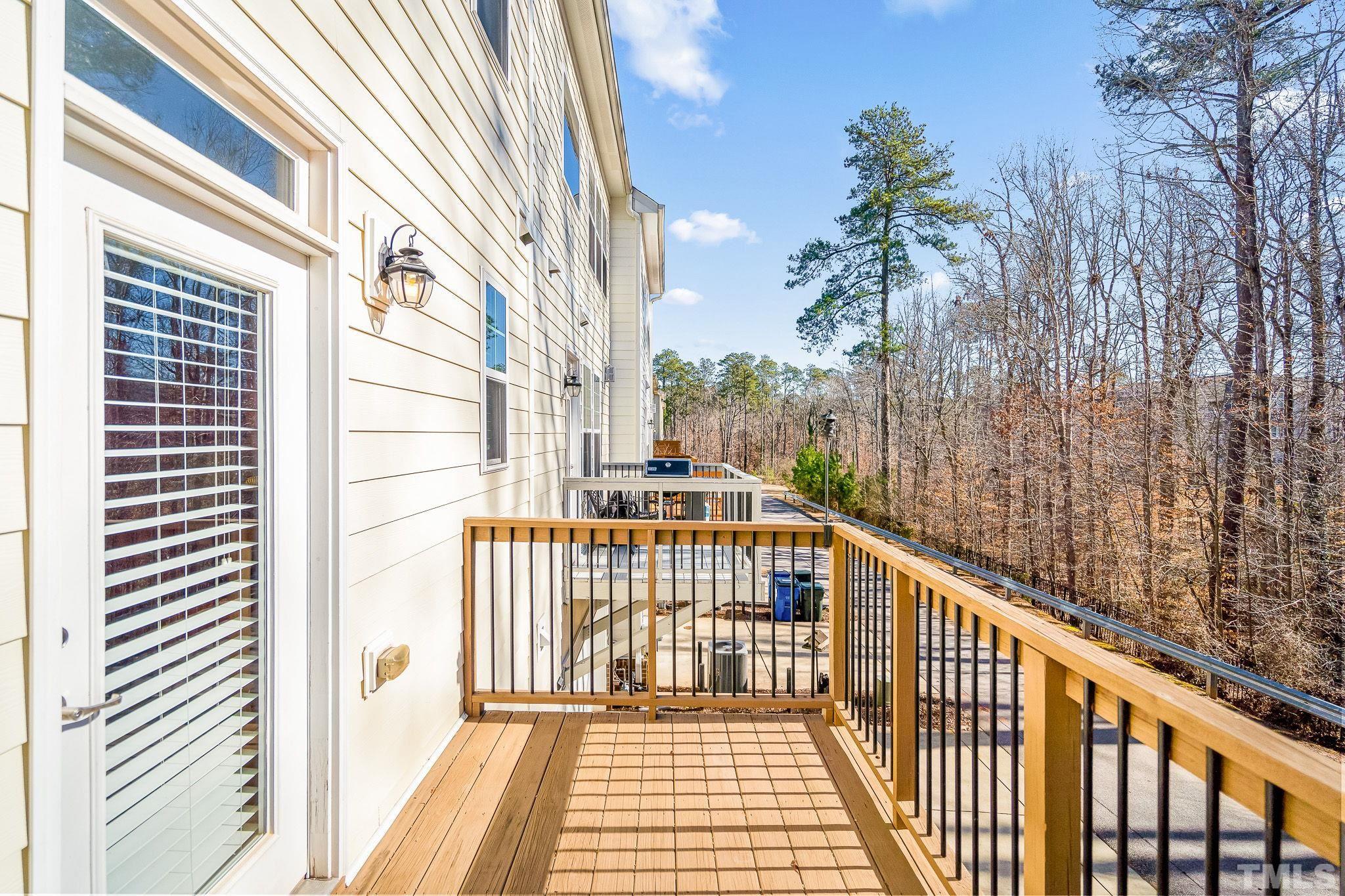 5637 Wade Park Boulevard Raleigh, NC 27607 - Photo 35 of 37 a view of a balcony with wooden floor and fence