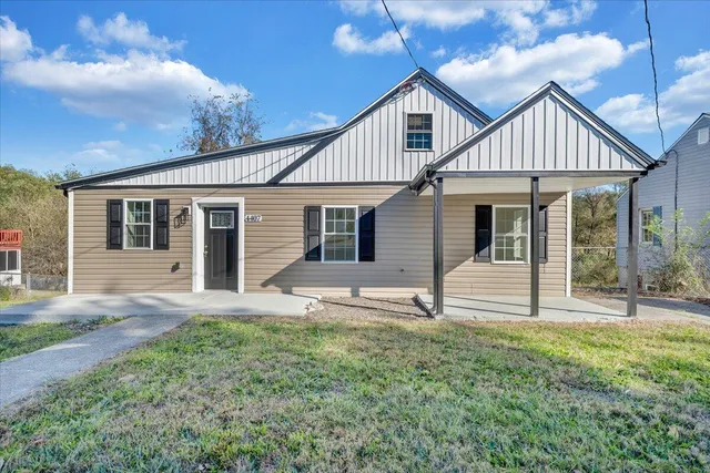front view of a house with a yard
