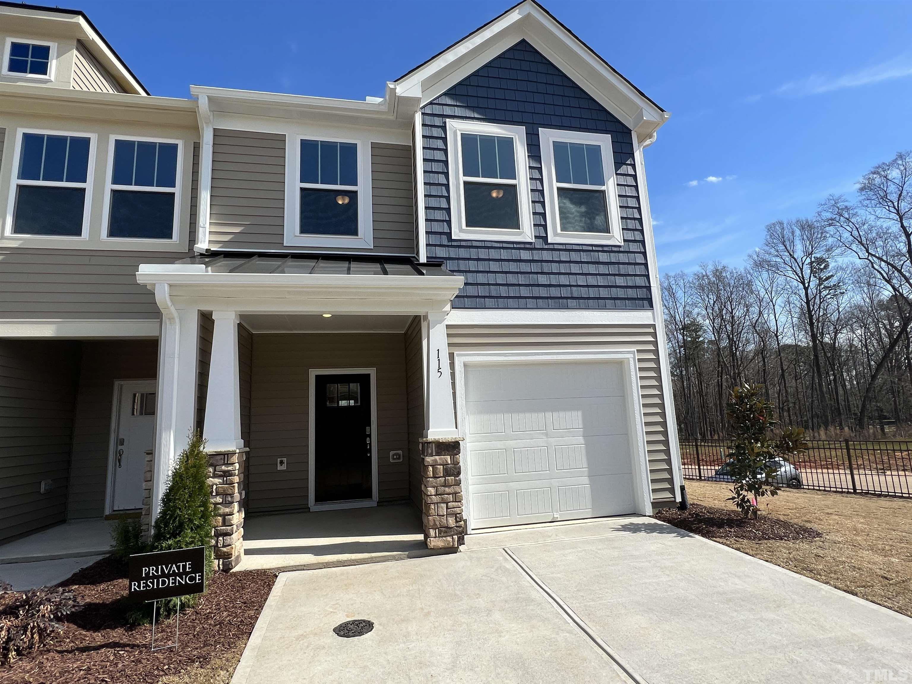a front view of a house with a garage