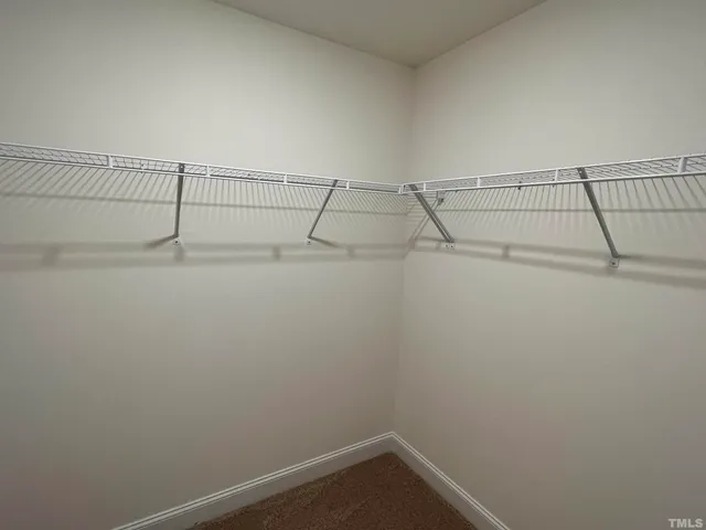 a view of a room with racks on the wall