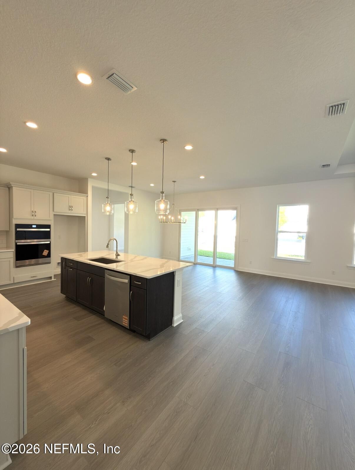 37 Callaway Circle St. Johns, FL 32259 - Photo 12 of 54 a large kitchen with a large counter top a stove a sink and a refrigerator