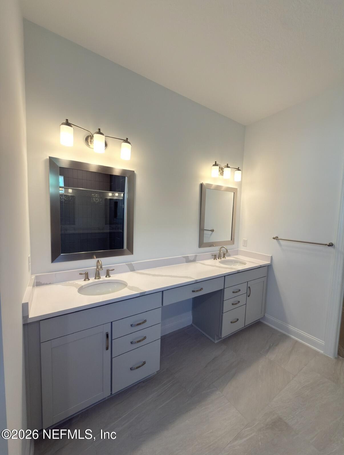 37 Callaway Circle St. Johns, FL 32259 - Photo 24 of 54 a bathroom with a sink double vanity granite and a mirror