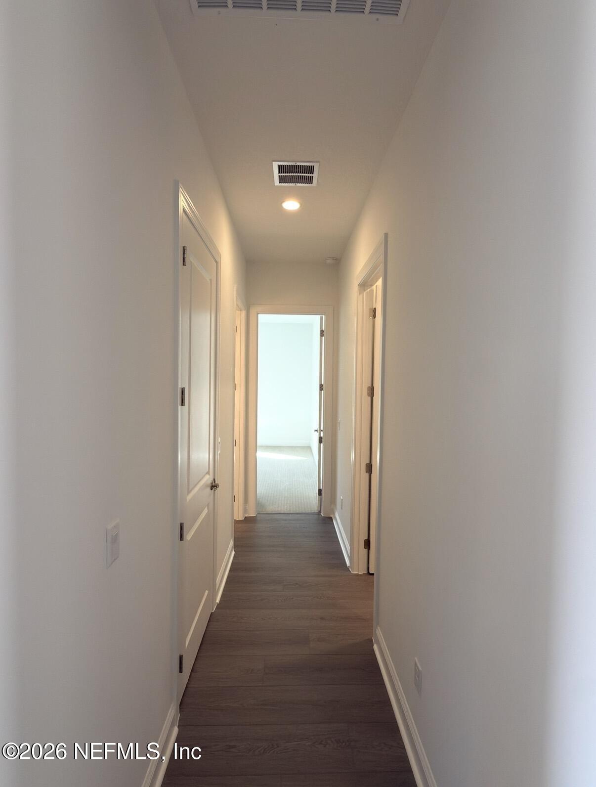 37 Callaway Circle St. Johns, FL 32259 - Photo 8 of 54 a view of a hallway with wooden shelves