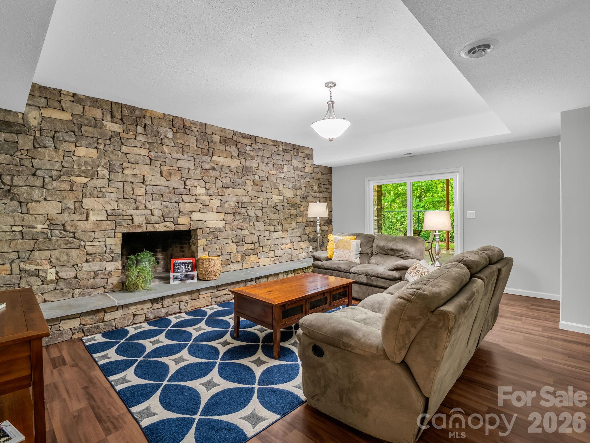 656 Cashiers Valley Road Brevard, NC 28712 - Photo 22 of 37 a living room with furniture and a fireplace