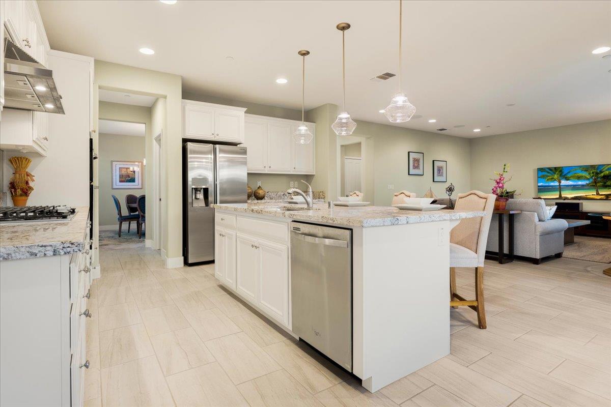 925 Lynx Place Gilroy, CA 95020 - Photo 13 of 49 a kitchen with a sink a counter top space appliances and cabinets