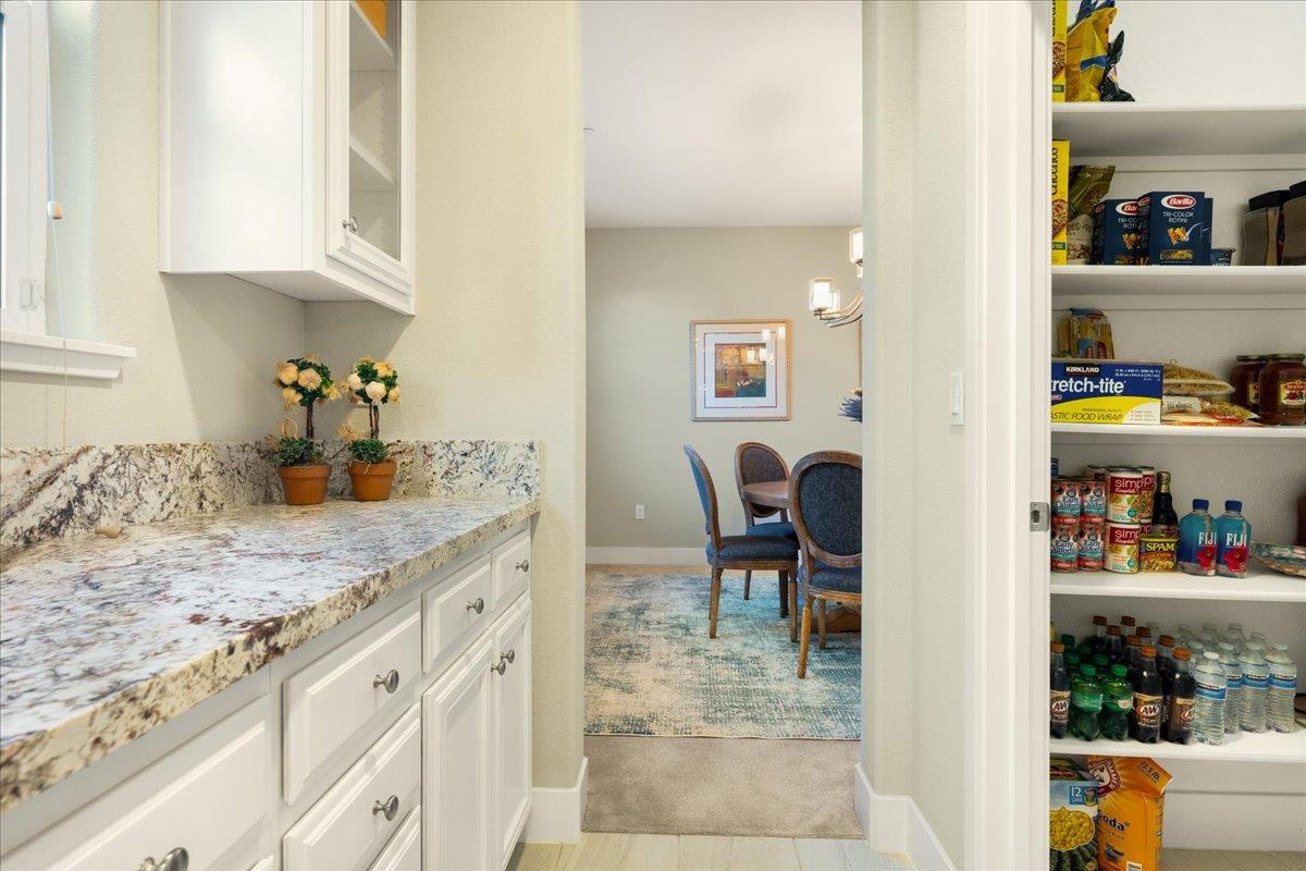925 Lynx Place Gilroy, CA 95020 - Photo 16 of 49 a kitchen with granite countertop cabinets and dining table