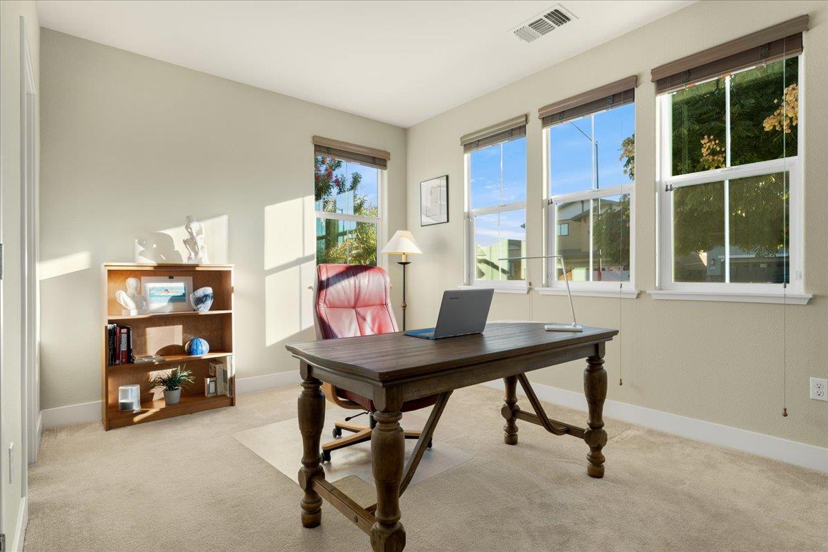 925 Lynx Place Gilroy, CA 95020 - Photo 21 of 49 a view of a workspace with furniture and a window