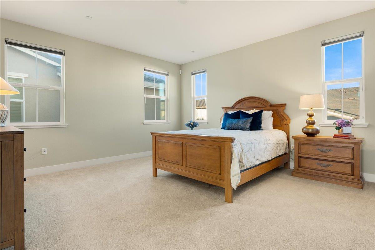 925 Lynx Place Gilroy, CA 95020 - Photo 24 of 49 a bedroom with a bed and a window