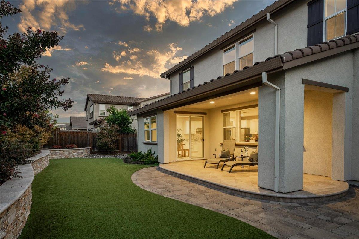 925 Lynx Place Gilroy, CA 95020 - Photo 38 of 49 a view of a porch with couches table and chairs and potted plants