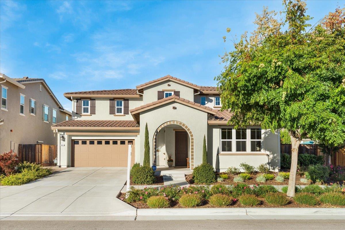 925 Lynx Place Gilroy, CA 95020 - Photo 5 of 49 a front view of a house with a yard