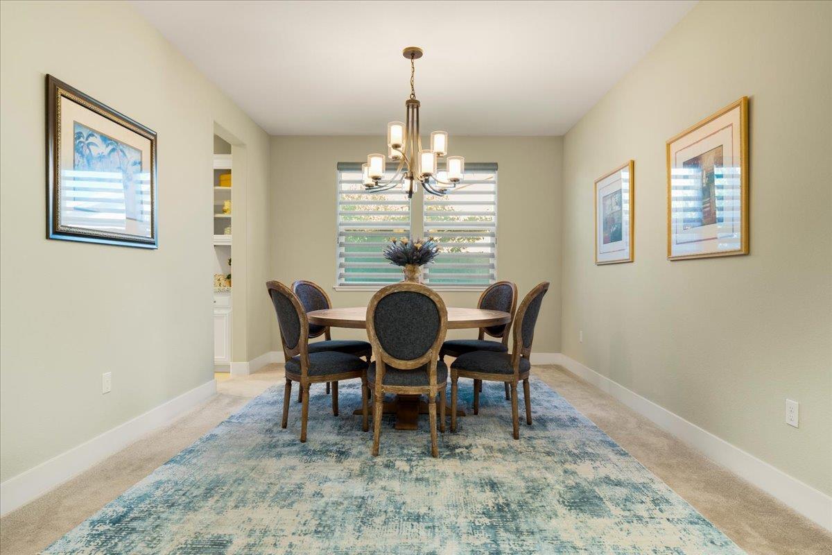 925 Lynx Place Gilroy, CA 95020 - Photo 9 of 49 a view of a dining room with furniture and chandelier