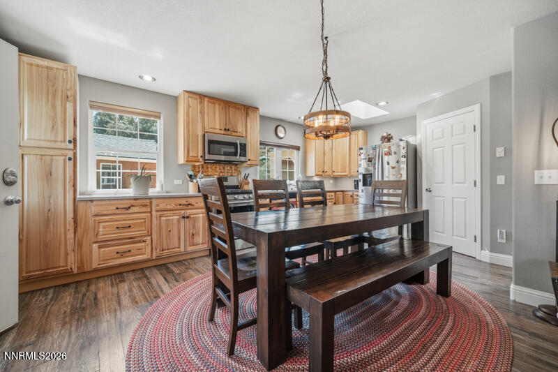 1931 Lousetown Road Reno, NV 89521 - Photo 28 of 51 a view of a dining room with furniture window and wooden floor