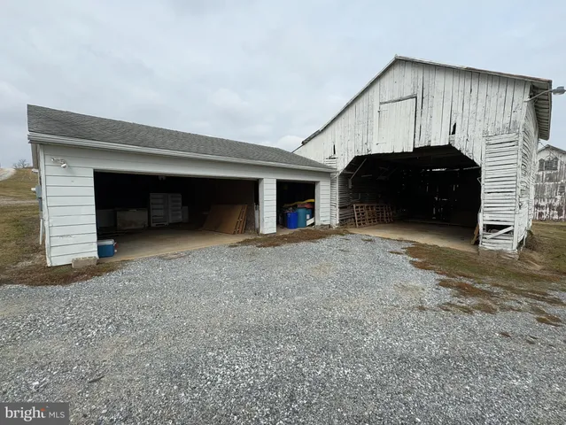 a view of empty room with wooden ceiling