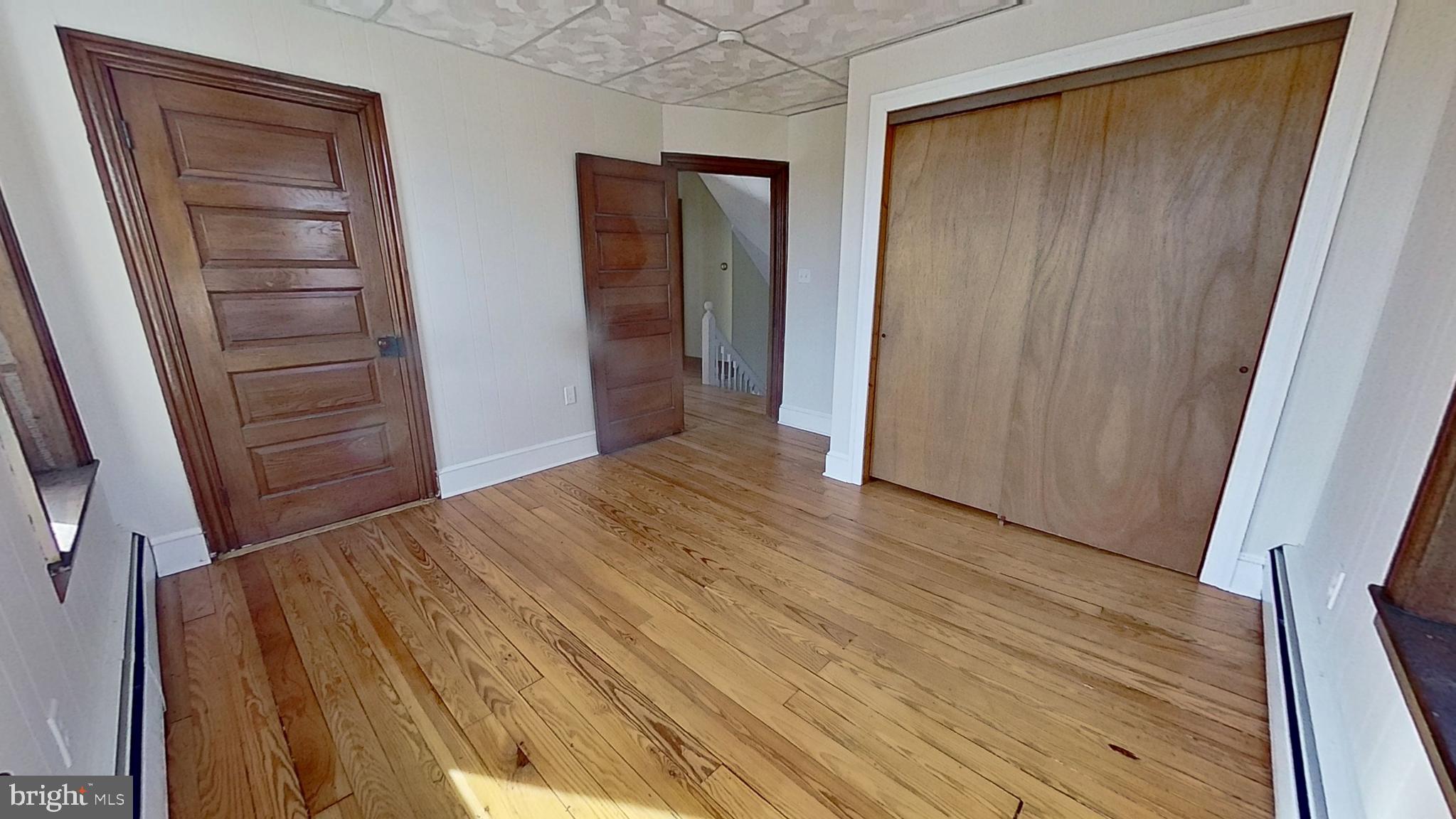 4676 Shaffers Church Road Glenville, PA 17329 - Photo 16 of 20 a view of hallway with wooden floor