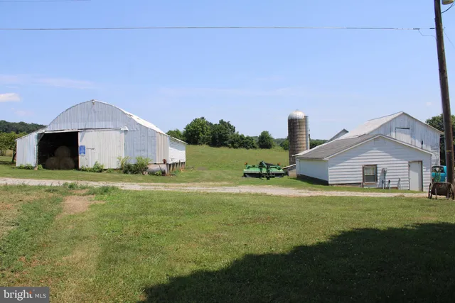 a front view of a house with a garden and yard