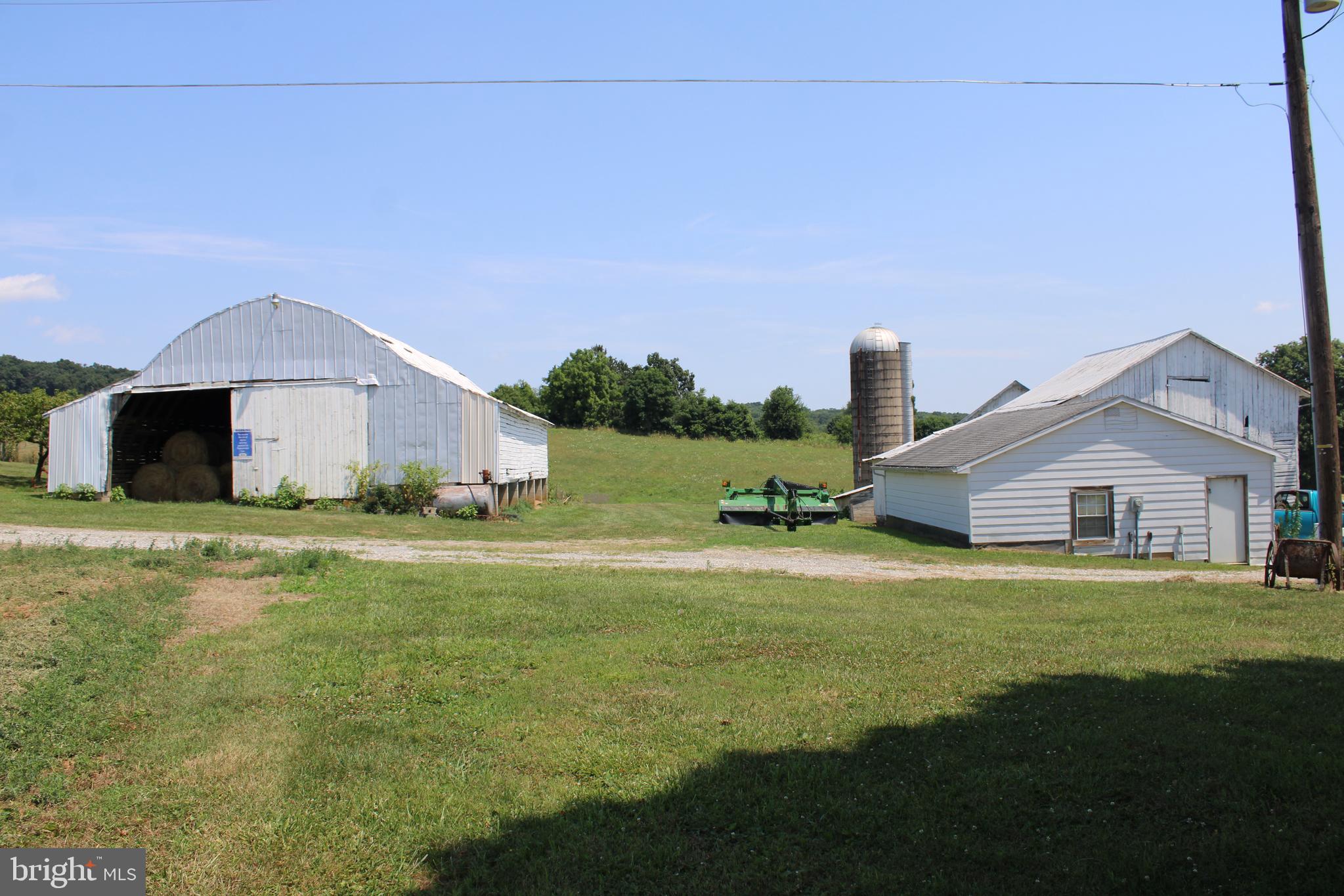 4676 Shaffers Church Road Glenville, PA 17329 - Photo 3 of 20 a front view of a house with a garden and yard