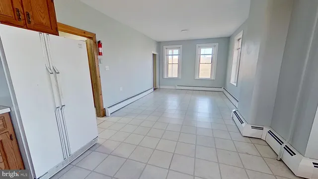 a view of an empty room with windows