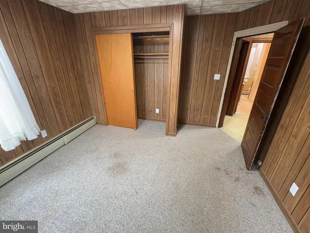 a bathroom with a tub a sink and a shower
