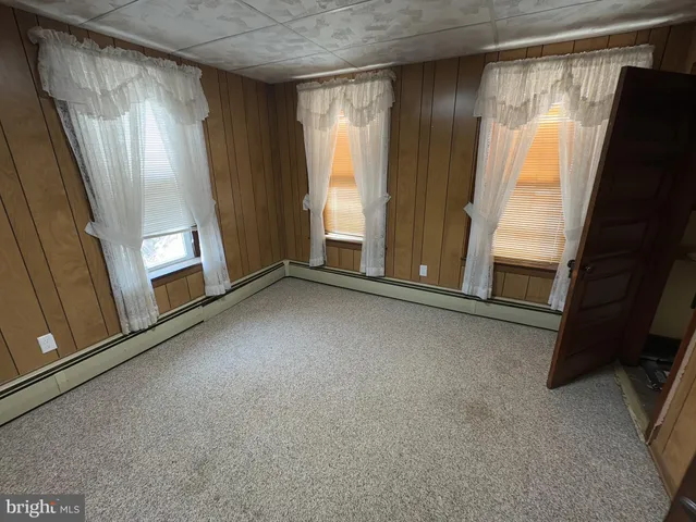 a view of hallway with windows