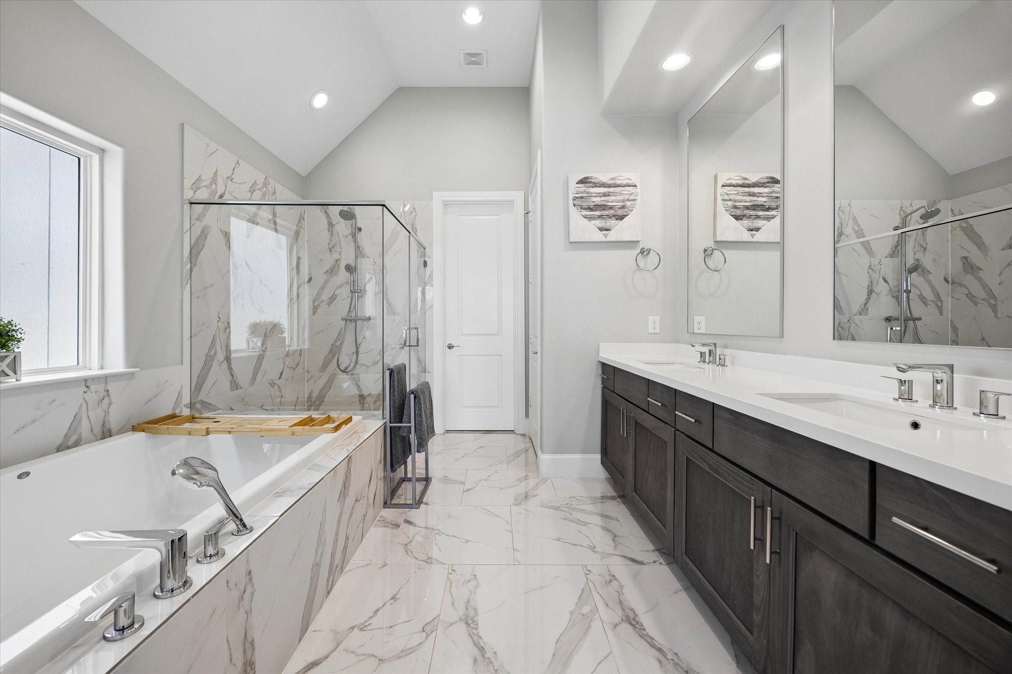 3312 West 12th Street Houston, TX 77008 - Photo 16 of 25 Luxurious, spa-style primary bath. Over-sized soaking tub, double vanity, glass-enclosed shower.