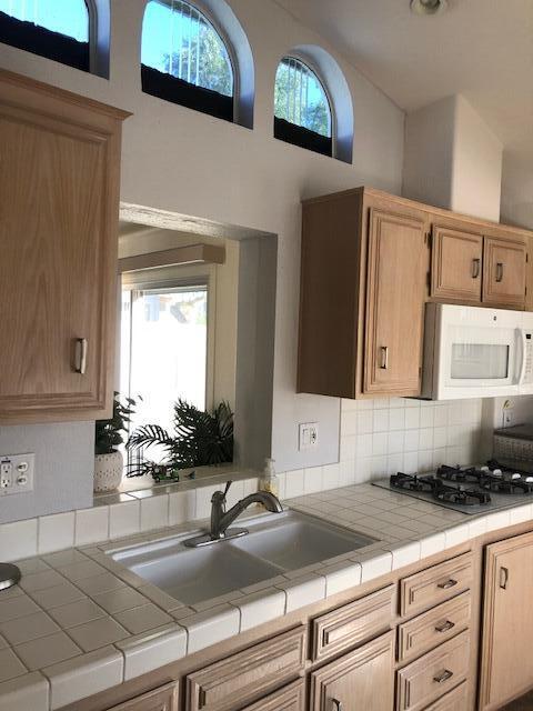 70200 Dillon Road, Unit 615 Desert Hot Springs, CA 92241 - Photo 16 of 32 Kitchen Sink and Indoor Window