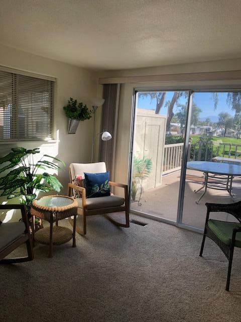70200 Dillon Road, Unit 615 Desert Hot Springs, CA 92241 - Photo 8 of 32 Family Rm Patio Open Curtains