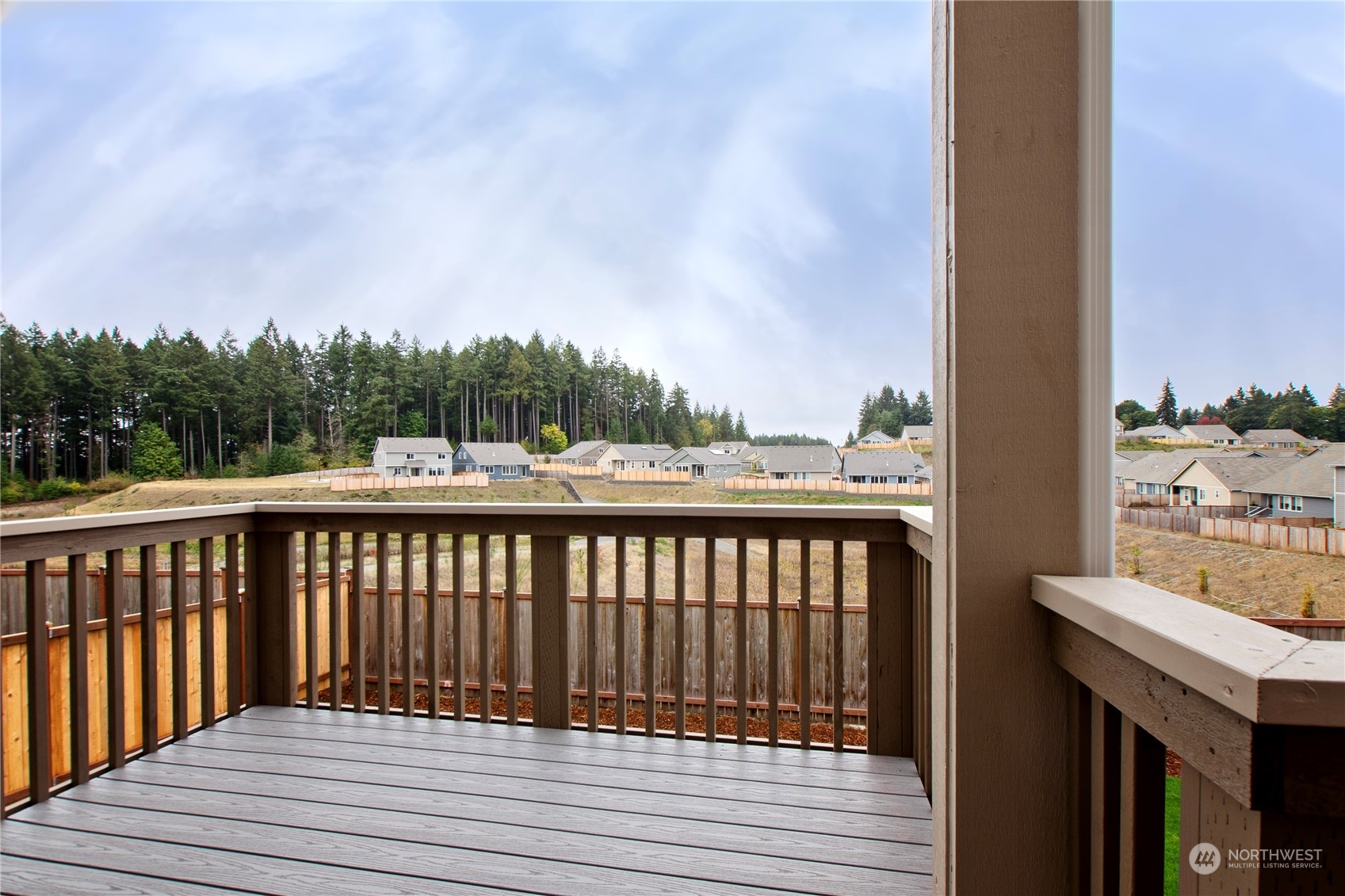 9741 7th Way Southeast Lacey, WA 98513 - Photo 37 of 40 a view of roof deck with wooden floor and fence
