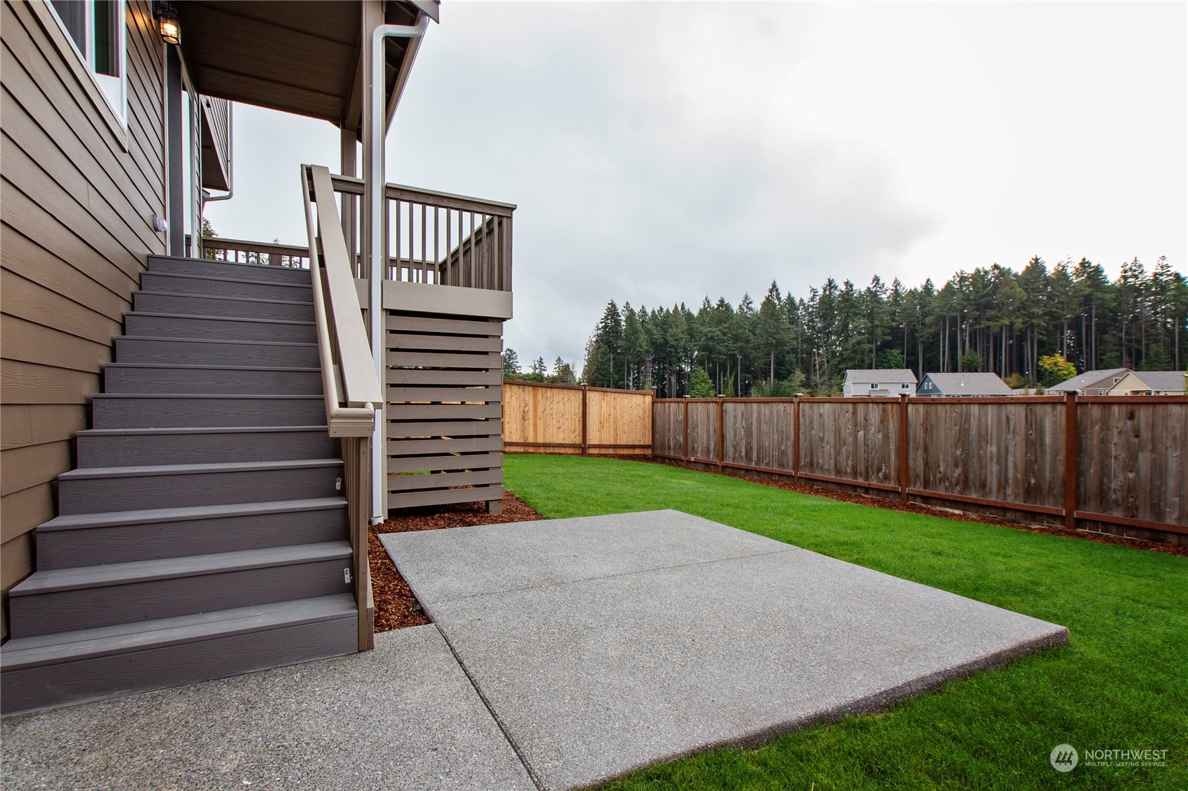 9741 7th Way Southeast Lacey, WA 98513 - Photo 38 of 40 a view of a backyard with wooden fence